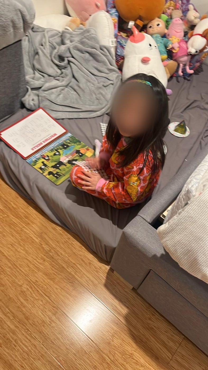 Child holding the busy book