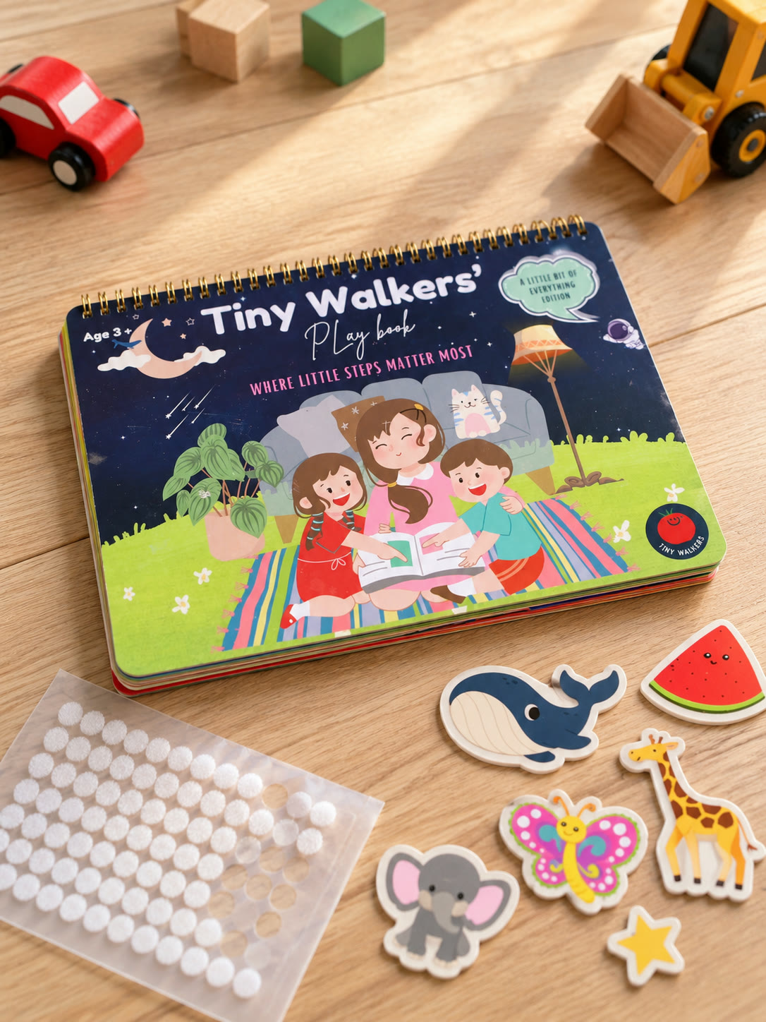 Play book with pieces and dot sheet among toys